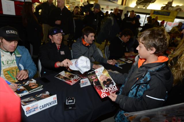 Ed Carpenter, Scott Dixon, and JR Hildebrand sign autographs at the Dan Wheldon Pro-Am Karting Classic -- Photo by: Chris Owens
