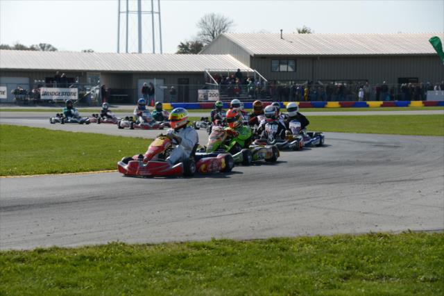 The field bunches together during a restart of the Dan Wheldon Pro-Am Karting Classic -- Photo by: Chris Owens