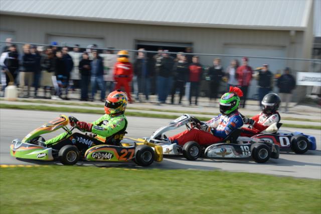 James Hinchcliffe, Conor Daly, and Zach Veach mix things up during the Dan Wheldon Pro-Am Karting Classic -- Photo by: Chris Owens