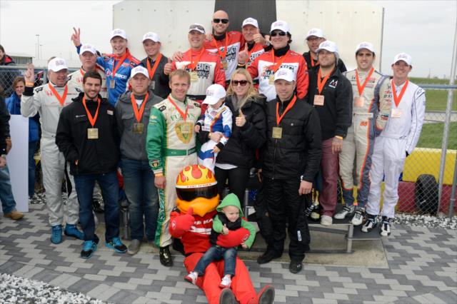 The entire podium from the Dan Wheldon Pro-Am Karting Classic pose with Susie Wheldon and her two sons -- Photo by: Chris Owens