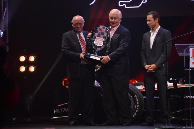 Roger Penske accepts the Verizon IndyCar Series 2nd Place Trophy on behalf of Helio Castroneves during the 2014 INDYCAR Championship Celebration -- Photo by: Chris Owens