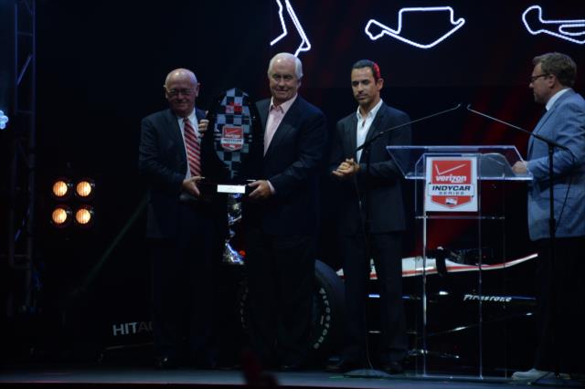 Roger Penske and Helio Castroneves accept the 2nd Place trophy during the 2014 INDYCAR Championship Celebration -- Photo by: John Cote