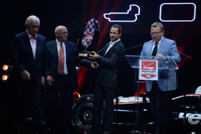 Helio Castroneves accepts the 2014 2nd Place Trophy during the 2014 INDYCAR Championship Celebration -- Photo by: John Cote