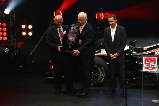 Roger Penske and Helio Castroneves receive the Verizon IndyCar Series 2nd Place Trophy at the 2014 Championship Celebration -- Photo by: Chris Jones