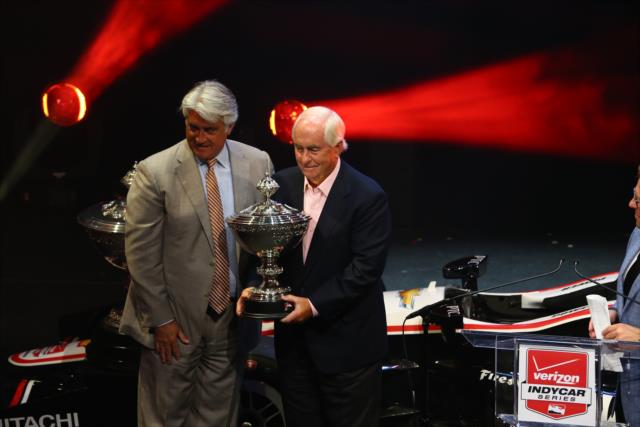 Roger Penske receives the Championship Team Owner's Mini-Astor Cup trophy from INDYCAR CEO Mark Miles at the 2014 Championship Celebration -- Photo by: Chris Jones