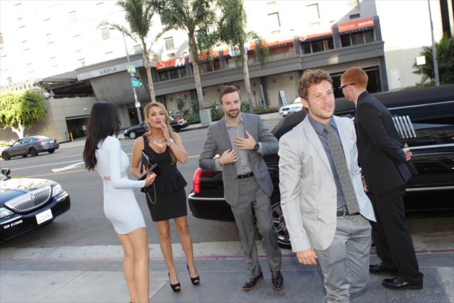 James Hinchcliffe, Marco Andretti, and their dates arrive in style to the 2014 INDYCAR Championship Celebration -- Photo by: Joe Skibinski
