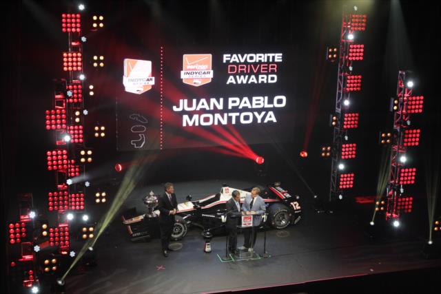 Juan Pablo Montoya receives the Fan Favorite Award at the 2014 INDYCAR Championship Celebration -- Photo by: Joe Skibinski