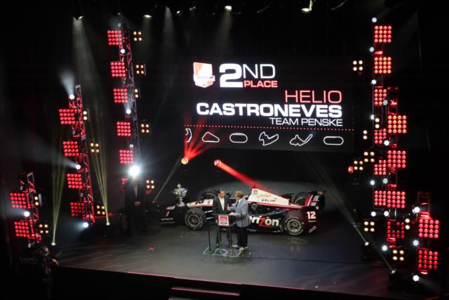 Helio Castroneves receives the 2014 Verizon IndyCar Series 2nd Place Trophy at the 2014 INDYCAR Championship Celebration -- Photo by: Joe Skibinski