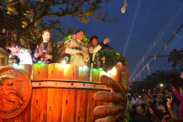 Carlos Munoz, James Hinchcliffe, Sage Karam, and Neil Alberico toss beads to the masses during the Krewe of Bacchus Mardi Gras parade in New Orleans -- Photo by: Chris Owens