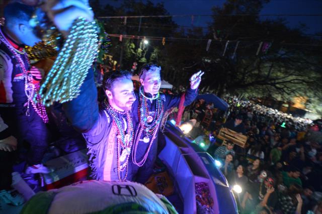 James Hinchcliffe and Josef Newgarden waive and toss beads during the Krewe of Bacchus Mardi Gras parade in New Orleans -- Photo by: Chris Owens