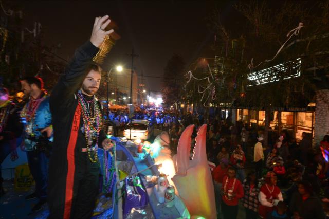 James Hinchcliffe tosses beads to the revelers during the Krewe of Bacchus Mardi Gras parade in New Orleans -- Photo by: Chris Owens