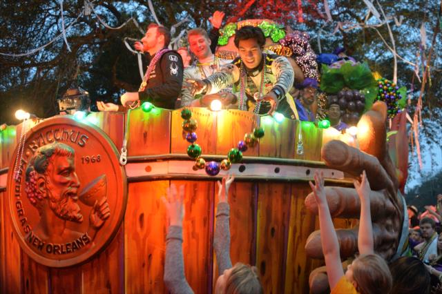 James Hinchcliffe, Sage Karam, and Neil Alberico ride aboard one of the Krewe of Bacchus Mardi Gras parade floats in New Orleans -- Photo by: Chris Owens