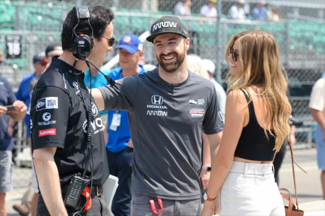 James Hinchclife and his girlfriend, Becky, chat with a Schmidt Peterson Motorsports crewman during qualifications for the 102nd Indianapolis 500 at the Indianapolis Motor Speedway -- Photo by: James  Black