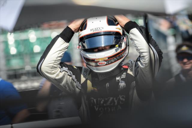 Ed Carpenter slides on his helmet along pit lane prior to his qualification attempt for the 102nd Indianapolis 500 at the Indianapolis Motor Speedway -- Photo by: James  Black