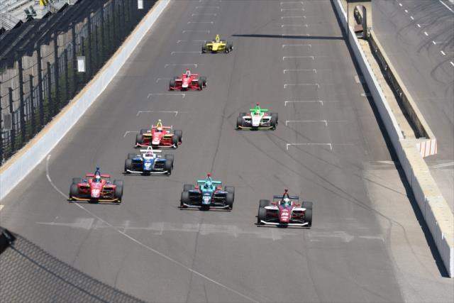 Victor Franzoni, Dalton Kellett, and Ryan Norman go three-wide setting up for Turn 1 during the 2018 Freedom 100 at the Indianapolis Motor Speedway -- Photo by: James  Black
