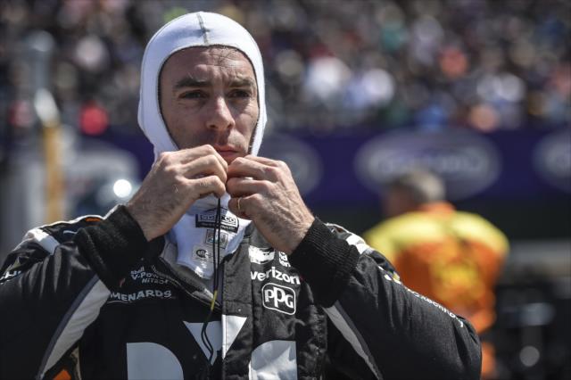 Simon Pagenaud preps his earpieces along pit lane prior to Race 2 of the Chevrolet Detroit Grand Prix at Belle Isle Park -- Photo by: Chris Owens