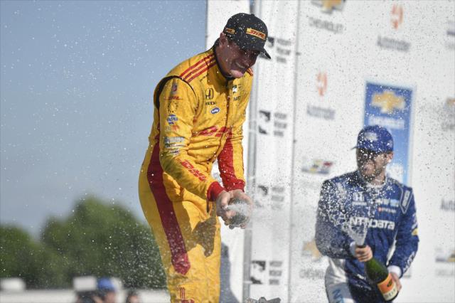 Ryan Hunter-Reay and Ed Jones spray the champagne in Victory Circle following Race 2 of the Chevrolet Detroit Grand Prix at Belle Isle Park -- Photo by: Chris Owens
