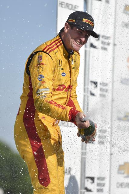 Ryan Hunter-Reay sprays the champagne in Victory Circle after winning Race 2 of the Chevrolet Detroit Grand Prix at Belle Isle Park -- Photo by: Chris Owens