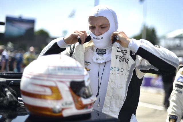 Jordan King adjusts his firesuit along pit lane prior to the start of Race 2 of the Chevrolet Detroit Grand Prix at Belle Isle Park -- Photo by: Chris Owens