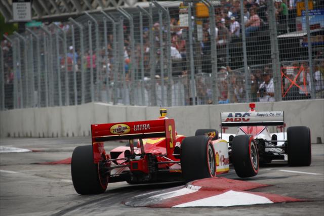 Vitor Meira and Helio Castroneves navigating the chicane -- Photo by: Chris Jones