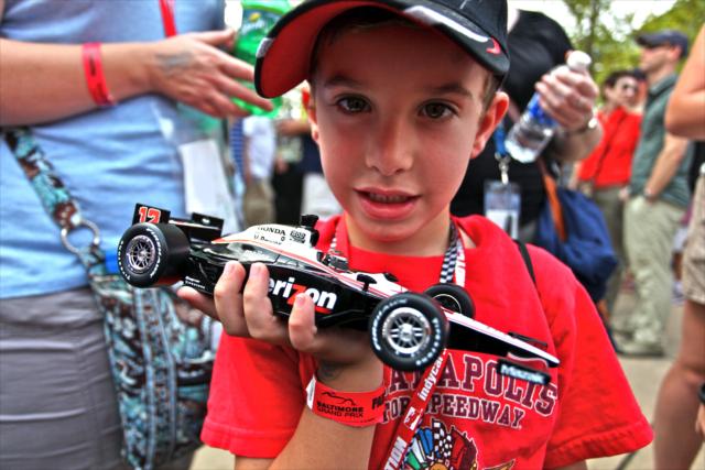 Young race fan with Will Power car -- Photo by: Shawn Gritzmacher