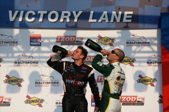 Will Power and Tony Kanaan enjoying champagne in victory circle -- Photo by: Chris Jones