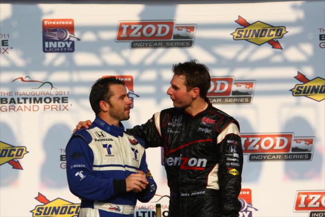 Will Power and Oriol Servia catching up in victory circle -- Photo by: Chris Jones