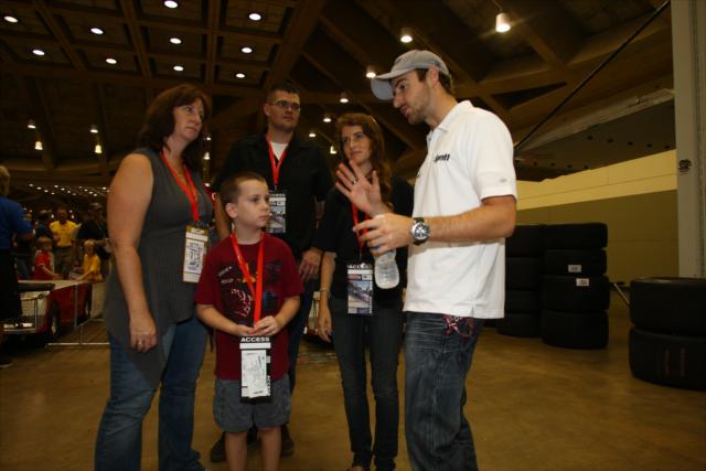 James Hinchcliffe walking with fans in the paddock -- Photo by: Chris Jones