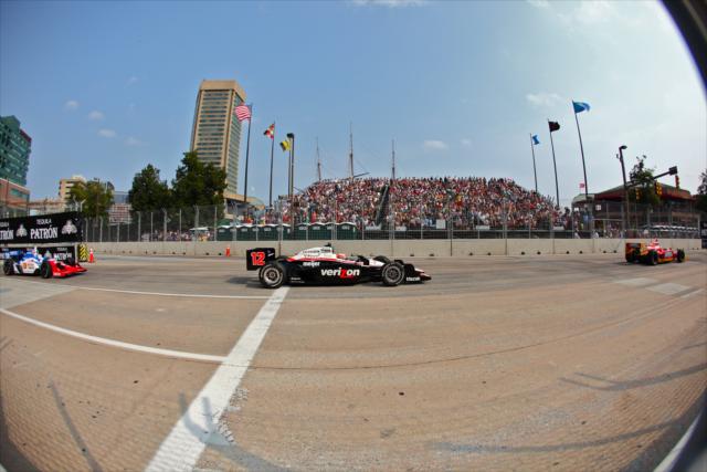 IZOD IndyCar Series cars travel down the main straight at the Streets of Baltimore -- Photo by: Shawn Gritzmacher
