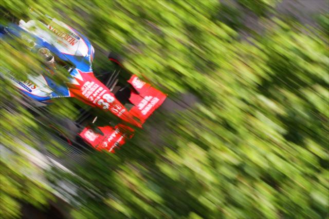 Graham Rahal on pace captured through a tree -- Photo by: Shawn Gritzmacher