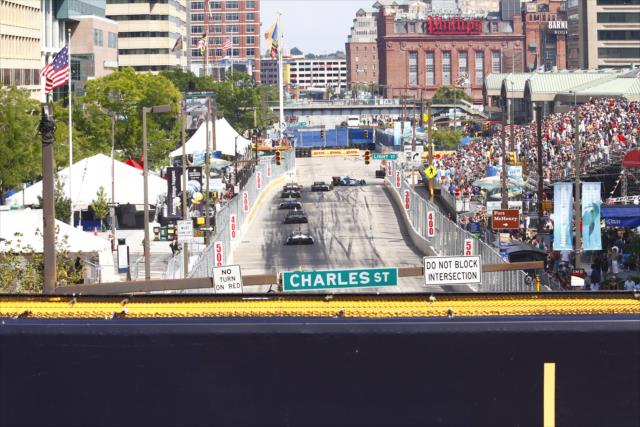 Cars dive into Turn 1 during the early stages of the Grand Prix of Baltimore -- Photo by: Bret Kelley
