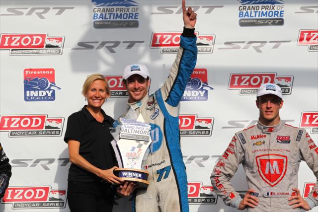 Simon Pagenaud receives his winners trophy for the 2013 Grand Prix of Baltimore -- Photo by: Chris Jones