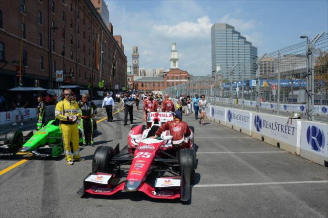 Marco Andretti and James Hinchcliffe are gridded on pit lane during pre-race festivities for the Grand Prix of Baltimore -- Photo by: Chris Owens