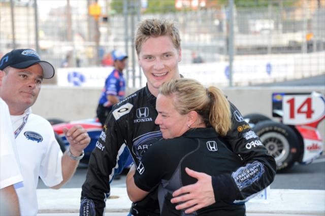 Sarah Fisher gives Josef Newgarden a hug following his 2nd place finish in the 2013 Grand Prix of Baltimore -- Photo by: Chris Owens