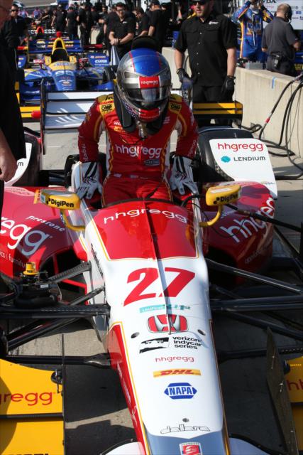 Marco Andretti slides into his No. 27 hhgregg Honda on pit lane prior to track activity during the open test at Barber Motorsports Park -- Photo by: Chris Jones