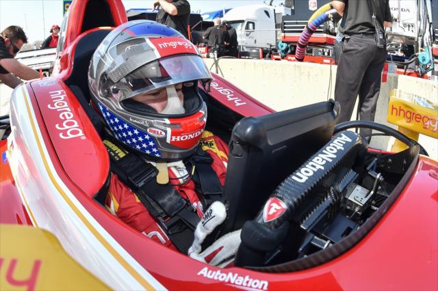 Marco Andretti looks over data while strapped in his machine on pit lane during the open test at Barber Motorsports Park -- Photo by: Chris Owens