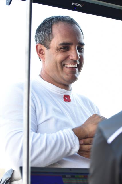 Juan Pablo Montoya chats with his Team Penske engineers on pit lane during the open test at Barber Motorsports Park -- Photo by: Chris Owens