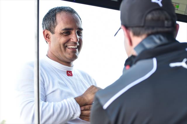 Juan Pablo Montoya chats with his Team Penske engineers on pit lane during the open test at Barber Motorsports Park -- Photo by: Chris Owens