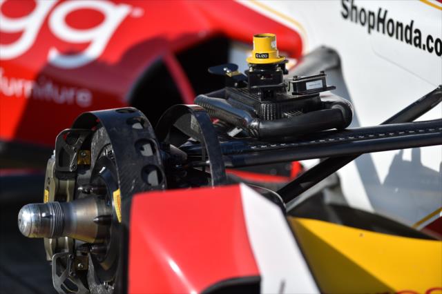 Marco Andretti's steering wheel sits on the front suspension assembly of his No. 27 hhgregg Honda at Barber Motorsports Park -- Photo by: Chris Owens