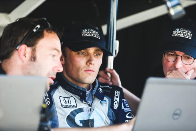 Max Chilton reviews data with his engineers on pit lane during the open test at Barber Motorsports Park -- Photo by: Joe Skibinski
