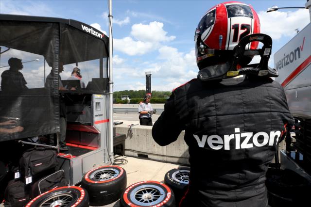Will Power straps on his helmet on pit lane prior to qualifications for the Honda Indy Grand Prix of Alabama -- Photo by: Joe Skibinski