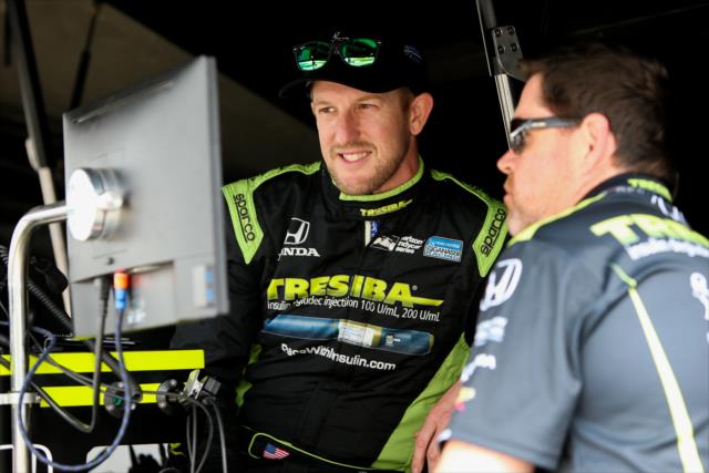Charlie Kimball reviews data in his pit stand following practice for the Honda Indy Grand Prix of Alabama at Barber Motorsports Park -- Photo by: Joe Skibinski