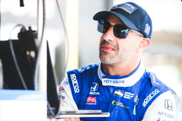 Tony Kanaan chats with his engineering team on pit lane prior to qualifications for the Honda Indy Grand Prix of Alabama -- Photo by: Joe Skibinski