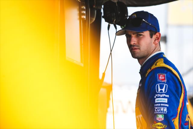 Alexander Rossi looks down pit lane from his stand prior to qualifications for the Honda Indy Grand Prix of Alabama -- Photo by: Joe Skibinski