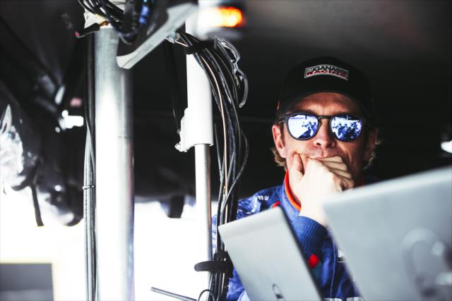 Scott Dixon looks on from his pit stand prior to qualifications for the Honda Indy Grand Prix of Alabama -- Photo by: Joe Skibinski