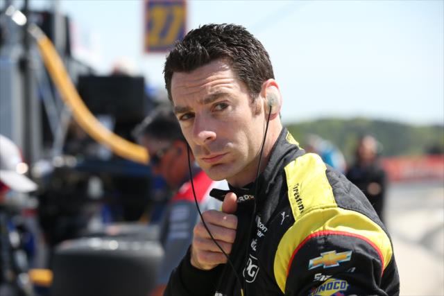 Simon Pagenaud zips up his firesuit along pit lane prior to practice for the Honda Indy Grand Prix of Alabama -- Photo by: Chris Jones