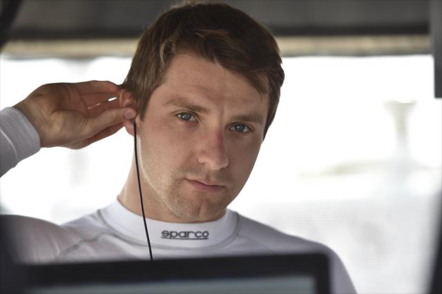 Jordan King sets his earpieces in his pit stand prior to qualifications for the Honda Indy Grand Prix of Alabama -- Photo by: Chris Owens