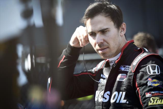 Robert Wickens sets his earpieces along pit lane prior to practice for the Honda Indy Grand Prix of Alabama -- Photo by: Chris Owens