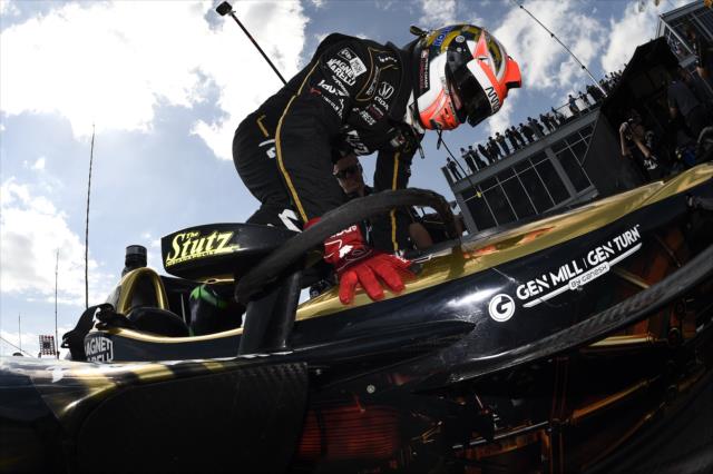 James Hinchcliffe slides into his No. 5 Arrow Honda on pit lane prior to qualifications for the Honda Indy Grand Prix of Alabama -- Photo by: Chris Owens