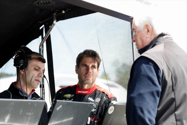 Will Power chats with team owner Roger Penske and chief engineer David Faustino in the pit stand prior to practice for the Honda Indy Grand Prix of Alabama -- Photo by: Joe Skibinski
